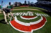 Andy Burnette, of the PNC Ground Crew paints, the Opening Week logo on the field at PNC Park Wednesday, March 27, 2019 in preparation for the Pittsburgh Pirates home-opener on Monday, April 1, against the St. Louis Cardinals. (AP Photo/Gene J. Puskar)