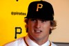 Pittsburgh Pirates first-round draft pick, Quinn Priester, a right-handed pitcher out of Cary-Grove High School in Cary, Illinois, answers questions after putting on his uniform shirt and cap after signing with the team at PNC Park in Pittsburgh, Tuesday, June 11, 2019. (AP Photo/Gene J. Puskar)