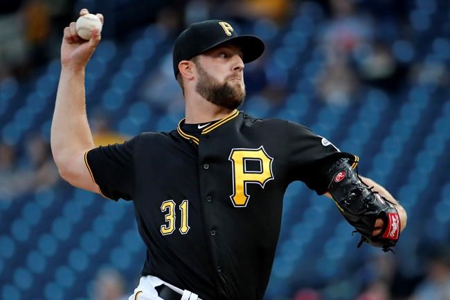 Pittsburgh Pirates starting pitcher Jordan Lyles delivers during the first inning of a baseball game against the St. Louis Cardinals in Pittsburgh, Wednesday, July 24, 2019. (AP Photo/Gene J. Puskar)