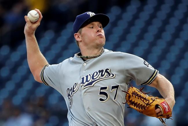 Milwaukee Brewers starting pitcher Chase Anderson delivers during the first inning of the team's baseball game against the Pittsburgh Pirates in Pittsburgh, Tuesday, Aug. 6, 2019. (AP Photo/Gene J. Puskar)