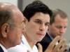 Pittsburgh Penguins' Sidney Crosby, center, and Dr. Michael Collins, right, listen as Dr. Ted Carrick, left, describes Crosby's progress in his recovery from a concussion he suffered in January 2011 during an NHL hockey news conference in Pittsburgh on Wednesday, Sept. 7, 2011. (AP Photo/Gene J. Puskar)