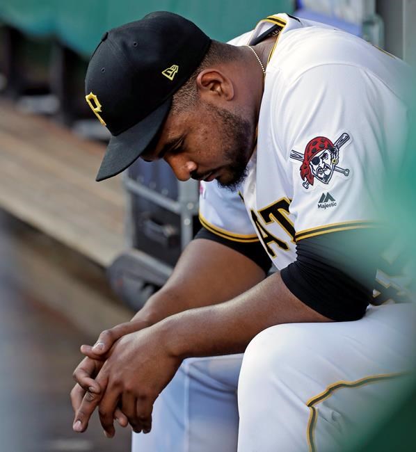 Pittsburgh Pirates relief pitcher Michael Feliz sits in the dugout after being removed from the team's baseball game after giving up a grand slam to Los Angeles Dodgers' David Freese during the first inning in Pittsburgh, Friday, May 24, 2019. (AP Photo/Gene J. Puskar)
