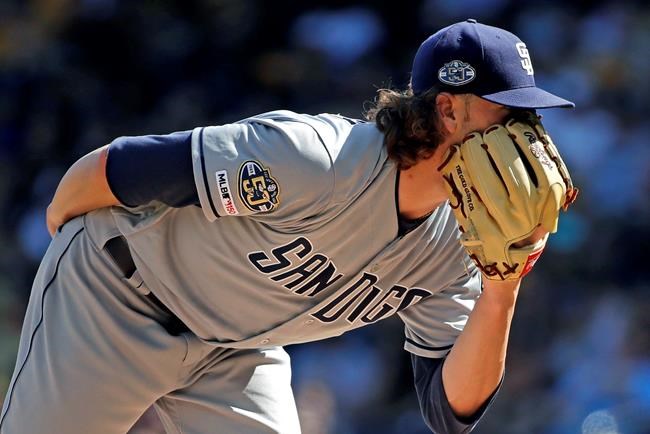 San Diego Padres starting pitcher Chris Paddack looks for the sign from catcher Francisco Mejia during the first inning of a baseball game against the Pittsburgh Pirates in Pittsburgh, Saturday, June 22, 2019. (AP Photo/Gene J. Puskar)