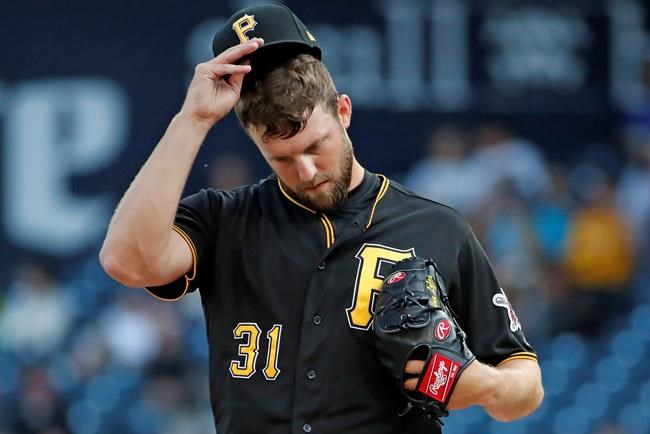 Pittsburgh Pirates starting pitcher Jordan Lyles collects himself on the mound during the first inning of a baseball game against the St. Louis Cardinals in Pittsburgh, Wednesday, July 24, 2019. (AP Photo/Gene J. Puskar)