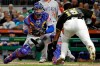 Chicago Cubs catcher Willson Contreras, left, moves into position to tag out Pittsburgh Pirates' Pablo Reyes who was attempting to score on a single by Erik Gonzalez during the second inning of a baseball game in Pittsburgh, Wednesday, Sept. 25, 2019. (AP Photo/Gene J. Puskar)