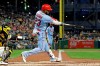 St. Louis Cardinals' Marcell Ozuna follows through on a three-run home run off Pittsburgh Pirates starting pitcher Steven Brault during the third inning of a baseball game in Pittsburgh, Saturday, Sept. 7, 2019. (AP Photo/Gene J. Puskar)