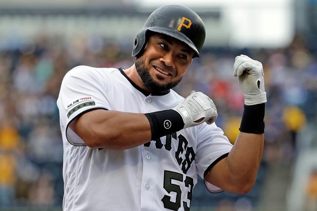 Pittsburgh Pirates' Melky Cabrera celebrates after driving in a run with a double off Colorado Rockies starting pitcher Antonio Senzatela during the first inning of a baseball game in Pittsburgh, Thursday, May 23, 2019. Cabrera advanced to third on the throw to the plate. (AP Photo/Gene J. Puskar)