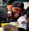 Pittsburgh Pirates' Gregory Polanco, center, celebrates with Melky Cabrera, left, after hitting a two-run home run off Texas Rangers starting pitcher Adrian Sampson during the fifth inning of a baseball game in Pittsburgh, Tuesday, May 7, 2019. (AP Photo/Gene J. Puskar)