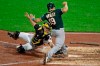 Pittsburgh Pirates catcher Francisco Cervelli, left,tags the foot of Oakland Athletics' Josh Phegley (19) who was attempting to score from second on a single to center field by Brett Anderson off relief pitcher Nick Kingham in the fourth inning of a baseball game in Pittsburgh, Friday, May 3, 2019. (AP Photo/Gene J. Puskar)