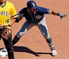 San Diego Padres' Fernando Tatis Jr., right, celebrates on second after driving in a run with an RBI double off Pittsburgh Pirates relief pitcher Clay Holmes during the sixth inning of a baseball game in Pittsburgh, Sunday, June 23, 2019. (AP Photo/Gene J. Puskar)