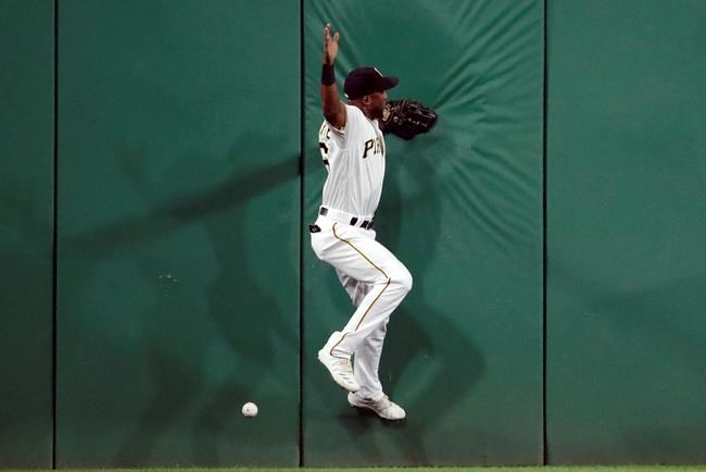 Pittsburgh Pirates center fielder Starling Marte can't handle a two-run double off the wall by St. Louis Cardinals' Paul DeJong during the seventh inning of a baseball game in Pittsburgh, Saturday, Sept. 7, 2019. (AP Photo/Gene J. Puskar)