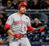 Cincinnati Reds' Joey Votto reacts after striking out against Pittsburgh Pirates relief pitcher Felipe Vazquez in the ninth inning of a baseball game in Pittsburgh, Friday, April 5, 2019. (AP Photo/Gene J. Puskar)