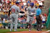 Chicago Cubs' Albert Almora Jr., right, is greeted by third base coach Brian Butterfield (55) as he round third base after hitting a solo home run off Pittsburgh Pirates starting pitcher Jordan Lyles during the second inning of a baseball game in Pittsburgh, Thursday, July 4, 2019. (AP Photo/Gene J. Puskar)