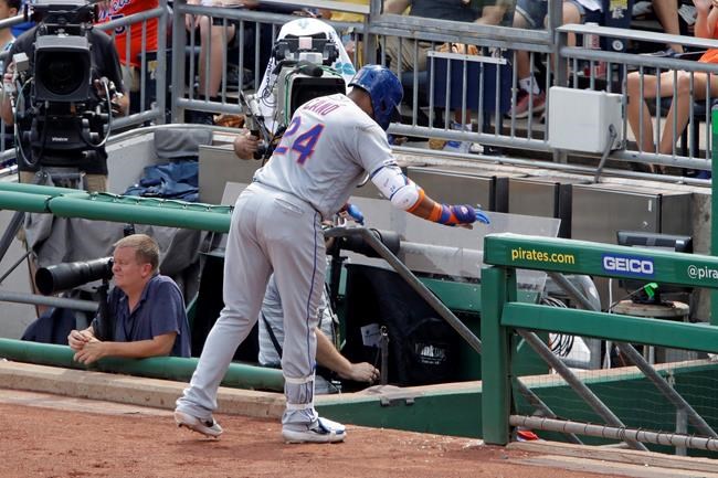 New York Mets' Robinson Cano makes his way to the dugout after injuring his left hamstring while rounding first base during the fourth inning of a baseball game against the Pittsburgh Pirates in Pittsburgh, Sunday, Aug. 4, 2019. (AP Photo/Gene J. Puskar)