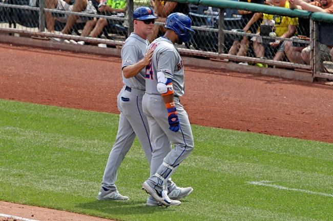 New York Mets' Robinson Cano, right, is helped off the field by first base coach Glenn Sherlock during the fourth inning of a baseball game against the Pittsburgh Pirates in Pittsburgh, Sunday, Aug. 4, 2019. (AP Photo/Gene J. Puskar)