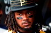 FILE - In this April 8, 2018, file photo, Pittsburgh Pirates' Josh Bell standing in the dugout before the team's baseball game against the Cincinnati Reds, in Pittsburgh. Bell spent most of the offseason addressing the power drain he suffered in 2018 when his home run total dropped from 26-12. (AP Photo/Gene J. Puskar/File)
