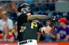 Pittsburgh Pirates' Kevin Newman hits a three-run home run against the Cincinnati Reds in the fifth inning of a baseball game, Friday, Sept. 27, 2019, in Pittsburgh. (AP Photo/Keith Srakocic)
