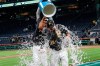 Pittsburgh Pirates' Bryan Reynolds (10) gets a bucket of ice water dumped over him by Chris Archer in celebration after Reynolds drove in two runs with a single in the ninth inning of a baseball game to defeat the Miami Marlins, Wednesday, Sept. 4, 2019, in Pittsburgh. The Pirates won 6-5. (AP Photo/Keith Srakocic)