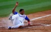 Johneshwy Fargas, of Puerto Rico's Cangrejeros de Santurce, slides home safely during the fourth inning on the opening day of the Caribbean Series baseball tournament against Dominican Republic's Las Estrellas Orientales at Rod Carew stadium in Panama City, Monday, Feb. 4, 2019. (AP Photo/Arnulfo Franco)