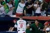 Dariel Alvarez of Mexico's Los Charros de Jaliscos is congratulated by Manny Rodriguez, right, after scoring a run against Venezuela's Cardenales de Lara in the fifth inning of a Caribbean Series baseball tournament game at the Rod Carew stadium in Panama City, Friday, Feb. 8, 2019. (AP Photo/Arnulfo Franco)