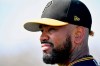 In this Wednesday, Feb. 20, 2019 photo, Pirates closer Felipe Vazquez takes a break during a spring baseball workout at Pirate City in Bradenton, Fla. Pittsburgh Pirates All-Star closer Felipe Vázquez was arrested Tuesday, Sept. 17, 2019 on multiple felony charges, including soliciting a child, statutory sexual assault and pornography and was placed on administrative leave by Major League Baseball. (Matt Freed/Pittsburgh Post-Gazette via AP)