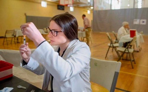FILE - In this Wednesday, May 8, 2019 file photo, University of Pittsburgh pharmacy student Alexandria Taylor prepares syringes during a free measles vaccination clinic by the Allegheny County Health Department at the Homewood-Brushton YMCA in Pittsburgh. On Monday, May 13, 2019, U.S. health officials say the year‚Äôs count of measles cases has surpassed 800, in a growing tally that already is the nation‚Äôs highest in 25 years. (Steph Chambers/Pittsburgh Post-Gazette via AP)