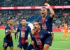 FILE - In this April 21, 2019 file photo, PSG's Kylian Mbappe, top, celebrates with teammate Dani Alves after scoring the third goal during the French League One soccer match between Paris-Saint-Germain and Monaco at the Parc des Princes stadium in Paris. After lifting the World Cup with France last summer, Mbappe now wants to win the European championships and a gold medal at the Tokyo Olympics next year. (AP Photo/Michel Euler, File)