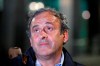 Michel Platini looks up after being freed, outside the French police anti-corruption and financial crimes office in Nanterre, outside Paris, early Wednesday, June 19, 2019. Former UEFA president Michel Platini proclaimed his innocence during police questioning Tuesday following his arrest as part of a corruption probe into the vote that gave the 2022 World Cup to Qatar. (AP Photo/ Francois Mori)