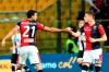 Genoa's Andrea Pinamonti, right, celebrates with his teammate Ivan Radovanovic after scoring his side's first goal during a Serie A soccer match between Parma and Genoa at the Ennio Tardini stadium in Parma, Italy, Sunday, Oct. 20, 2019. Parma won 5-1. (Serena Campanini/ANSA via AP)