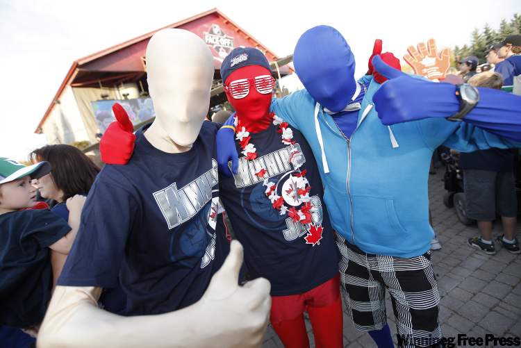 John Woods / Winnipeg Free Press
Murphy 2, left, Murphy, and Big Bluie, right, show their support for the Winnipeg Jets at the NHL Faceoff party at The Forks Thursday.