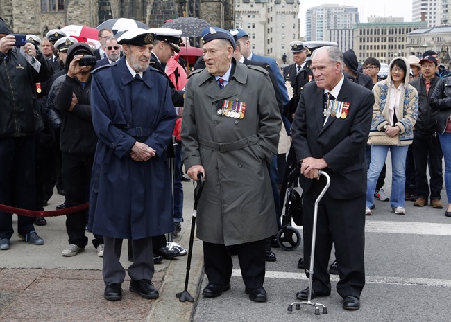 Veterans, merchant marine Hal Roberts, left, Brigadier-General Stanley Parkhouse, center, Rear-Admiral Charles Knight, right, wait for the arrival of dignitaries during the Battle of the Atlantic memorial services on Parliament Hill in Ottawa on Sunday, May 1, 2016. THE CANADIAN PRESS/ Patrick Doyle
