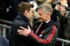 Manchester United caretaker manager Ole Gunnar Solskjaer, right, greets Tottenham manager Mauricio Pochettino, left, prior to the English Premier League soccer match between Tottenham Hotspur and Manchester United at Wembley stadium in London, England, Sunday, Jan. 13, 2019. (AP Photo/Matt Dunham)