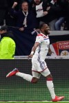 Lyon's Moussa Dembele celebrates scoring his side's first goal during the French League One soccer match between Lyon and Paris Saint-Germain in Decines, near Lyon, central France, Sunday, Feb. 3, 2019. (AP Photo/Laurent Cipriani)