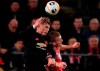 Manchester United's Brandon Williams, left, and Alkmaar's Dani de Wit jump to head the ball during the group L Europa League soccer match between AZ Alkmaar and Manchester United at the ADO Den Haag stadium in The Hague, Netherlands, Thursday, Oct. 3, 2019. (AP Photo/Peter Dejong)