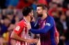 Barcelona's Gerard Pique, right, talks to Atletico forward Diego Costa as he tries to calm him after he was sent off with a red card for insulting referee Jesus Gil Manzano during a Spanish La Liga soccer match between FC Barcelona and Atletico Madrid at the Camp Nou stadium in Barcelona, Spain, Saturday April 6, 2019. (AP Photo/Manu Fernandez)