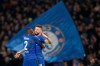 Fans display a large Chelsea flag as Chelsea's Antonio Rudiger, left, hugs Chelsea's Oliver Giroud who scored his side's first goal during the round of 32, second leg, Europa League soccer match between Chelsea and Malmo FF at Stamford Bridge stadium in London, Thursday Feb. 21, 2019. (AP Photo/Frank Augstein)
