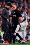 Liverpool's Naby Keita, right, shows his injury to Liverpool coach Juergen Klopp, left, during the Champions League semifinal first leg soccer match between FC Barcelona and Liverpool at the Camp Nou stadium in Barcelona, Spain, Wednesday, May 1, 2019. (AP Photo/Manu Fernandez)