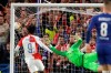 Chelsea goalkeeper Kepa Arrizabalaga dives but fails to stop Slavia's Petr Sevcik's second goal, and his team's third, during the Europa League quarterfinal, second leg, soccer match between Chelsea and Slavia Prague at Stamford Bridge stadium in London, Thursday, April 18, 2019. (AP Photo/Matt Dunham)