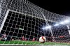 Atletico goalkeeper Jan Oblak, down left corner, fails to stop Barcelona forward Luis Suarez' shot on goal giving Barcelona a 1-0 lead during a Spanish La Liga soccer match between FC Barcelona and Atletico Madrid at the Camp Nou stadium in Barcelona, Spain, Saturday April 6, 2019. (AP Photo/Manu Fernandez)