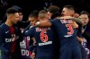 Teammates congratulate PSG's Kylian Mbappe, second left, after he scored his side's first goal during their French League One soccer match between Paris-Saint-Germain and Olympique Marseille at the Parc des Princes stadium in Paris, Sunday, March 17, 2019. (AP Photo/Christophe Ena)
