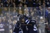 John Woods / The Canadian Press 
Winnipeg Jets' Jacob Trouba (8) celebrates his goal against the Pittsburgh Penguins with Evander Kane (9) and other teammates  in Winnipeg.