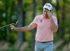 Luke list hands his putter to his caddie after putting on the seventh green during the second round of the PGA Championship golf tournament, Friday, May 17, 2019, at Bethpage Black in Farmingdale, N.Y. (AP Photo/Julio Cortez)