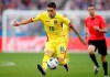 FILE - In this file picture taken on Friday, June 10, 2016, Romania's Nicolae Stanciu goes for the ball during the Euro 2016 Group A soccer match against France, at the Stade de France, north of Paris. Romania midfielder Nicolae Stanciu has completed a transfer from Saudi Arabia's club Al-Ahli to Slavia Prague, on Thursday July 4, 2019, the Czech champion says the 26-year-old Stanciu has signed a four-year-contract. (AP Photo/Christophe Ena)