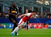 Inter Milan's Romelu Lukaku, left, challenges Slavia's David Hovorka during the Champions League group F soccer match between Inter Milan and Slavia Prague at the San Siro stadium in Milan, Italy, Tuesday, Sept. 17, 2019. (AP Photo/Antonio Calanni)