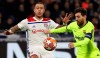 Lyon forward Memphis Depay, left, challenges Barcelona forward Lionel Messi, right, during the Champions League round of 16 first leg soccer match between Lyon and FC Barcelona in Decines, near Lyon, central France, Tuesday, Feb. 19, 2019. (AP Photo/Laurent Cipriani)