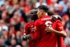Liverpool's Sadio Mane, left, celebrates with Liverpool's Roberto Firmino, center, and Liverpool's Mohamed Salah, right, after scoring his sides second goal during the English Premier League soccer match between Liverpool and Newcastle at Anfield stadium in Liverpool, England, Saturday, Sept. 14, 2019. (AP Photo/Rui Vieira)