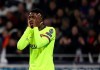 Barcelona forward Ousmane Dembele holds his face during the Champions League round of 16 first leg soccer match between Lyon and FC Barcelona in Decines, near Lyon, central France, Tuesday, Feb. 19, 2019. (AP Photo/Laurent Cipriani)