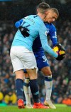 Everton's Richarlison, right, challenges for the ball Manchester City's Aymeric Laporte, left, during the English Premier League soccer match between Manchester City and Everton at Etihad stadium in Manchester, England, Saturday, Dec. 15, 2018. (AP Photo/Rui Vieira)