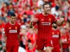 Liverpool's Jordan Henderson celebrates after the English Premier League soccer match between Liverpool and Arsenal at Anfield stadium in Liverpool, England, Saturday, Aug. 24, 2019. (AP Photo/Rui Vieira)