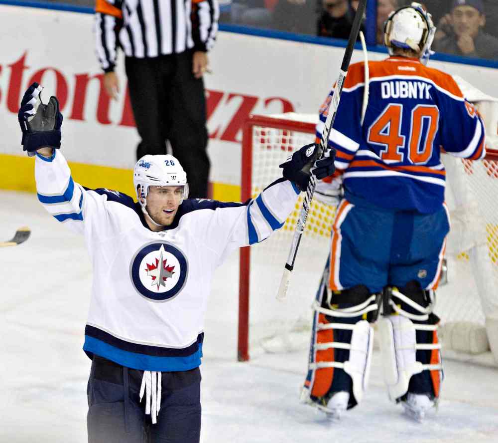 Jason Franson / The Canadian Press
Winnipeg Jets' Blake Wheeler (26) celebrates a goal against Edmonton Oilers goalie Devan Dubnyk (40) during first-period NHL hockey action in Edmonton Tuesday.